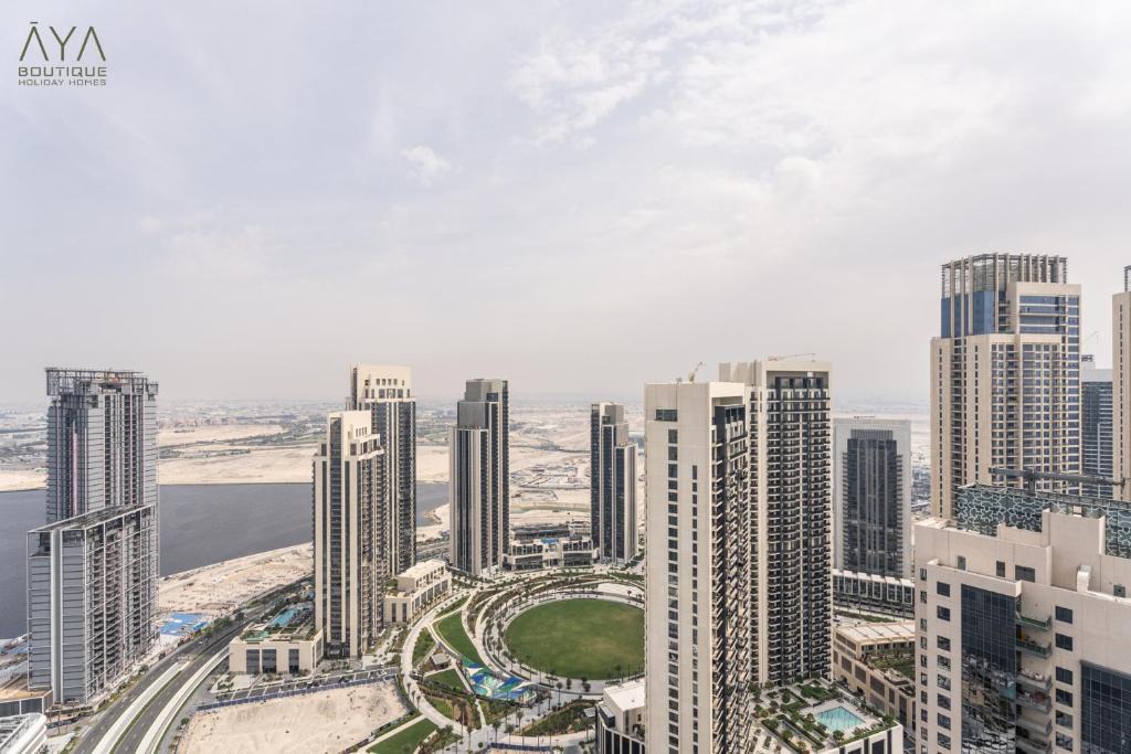 Dubai Apartment | Elegant Luxury Apartment with Stunning Lake Views in Dubai Creek Harbour By ĀYA Boutique