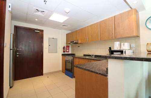 Dubai Sports City Apartment | Ample Studio Apartment in Cricket Tower- Sports City