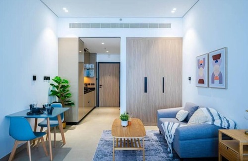 Dubai Production City Apartment | Breezy Dubai Evenings: Chic Studio in MYKA, IMPZ