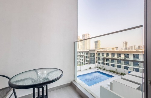 Jumeirah Village Circle Apartment | Pool View Studio with Balcony Close to Mall, Concept 7 Residences