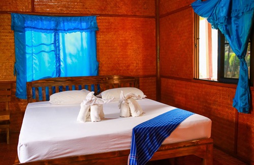 Mae Wang Cabin | a room with rice fields view