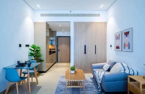 Dubai Production City Apartment | Breezy Dubai Evenings: Chic Studio in MYKA, IMPZ