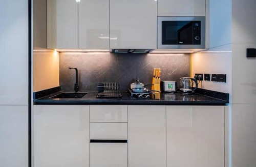 Dubai Production City Apartment | Breezy Dubai Evenings: Chic Studio in MYKA, IMPZ