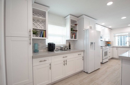Isles of Capri House | CAPRI PARADISE! Beautiful waterfront home. Solar heated pool, 130ft dock.