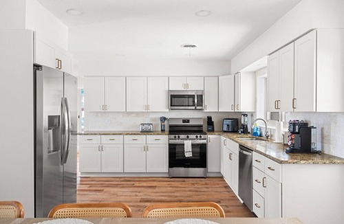 Clearwater House | Clearwater ICONIC Heated Pool Home, Mini Golf, Sleeps 11