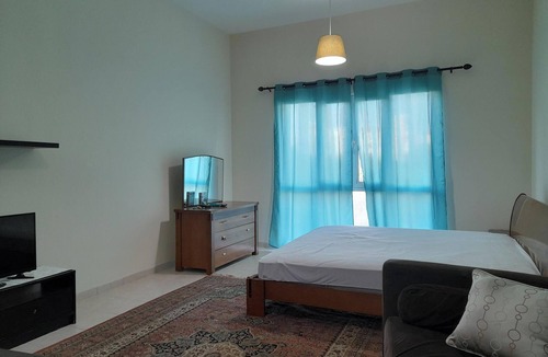 Jumeirah Village Triangle Apartment | Cozy studio with AC and WiFi in marvelous Dubai