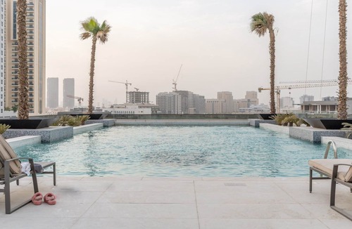 Jumeirah Village Circle Apartment | GuestReady - Arabic Charm | Balcony | Regina Tower