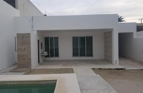 Chicxulub Puerto House | Minimalist house with pool and patio