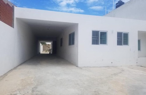 Chicxulub Puerto House | Minimalist house with pool and patio