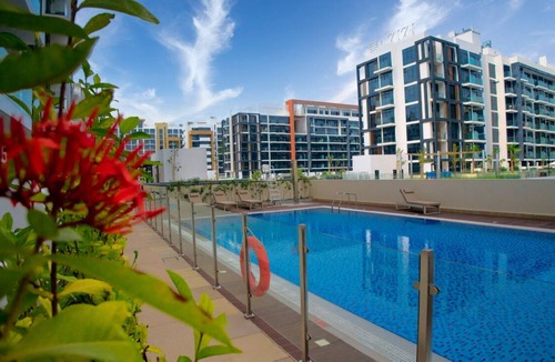 Nad Al Sheba Apartment | Modern apartment in vibrant Dubai with AC, fitness room, WiFi