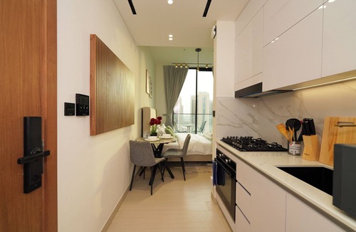 Jumeirah Village Circle Apartment | Modern Studio with Balcony Views of FIVE Hotels