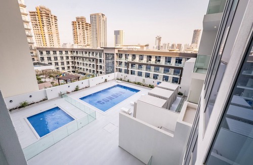 Jumeirah Village Circle Apartment | Pool View Studio with Balcony Close to Mall, Concept 7 Residences