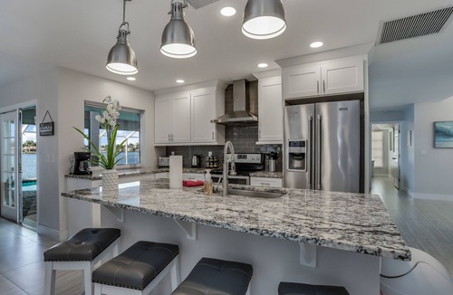 Eight Lakes House | Remodeled waterfront home with pool, lanai, private dock, & WiFi - snowbirds OK