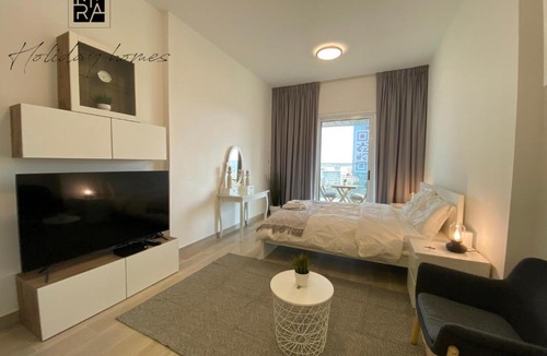 Jumeirah Village Circle Apartment | Serviced Studio in Bloom Heights by Mira Holiday Homes