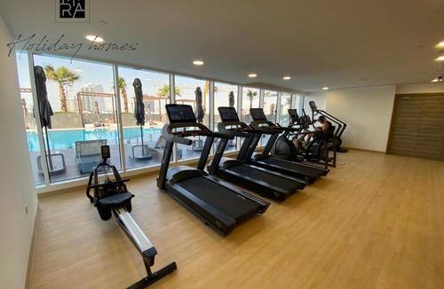 Jumeirah Village Circle Apartment | Serviced Studio in Bloom Heights by Mira Holiday Homes