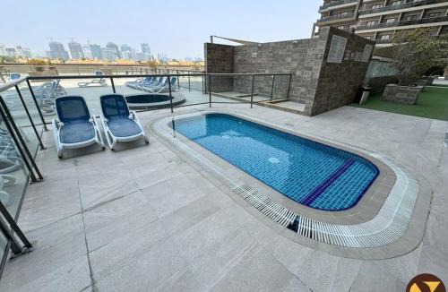 Dubai Sports City Apartment | Vogue Elite Sports City One Bedroom Apartment with Balcony with Golf Views