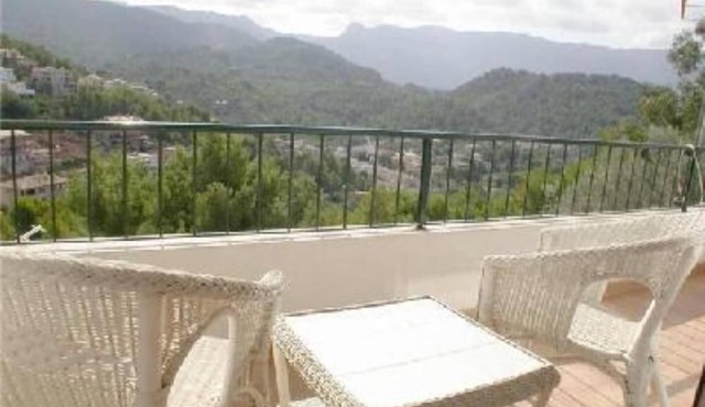 Accommodation on harbor and beach with mountain views