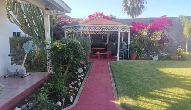 Tranquil gated home, lovely gardens great view, 5 minutes to beach.