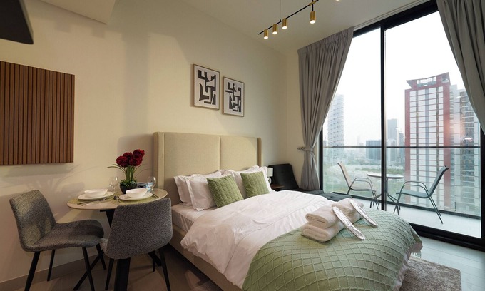 Jumeirah Village Circle Apartment | Modern Studio with Balcony Views of FIVE Hotels